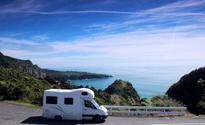 Campervan on coastline of New Zealand